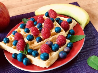 Fresh waffles with garden fruits