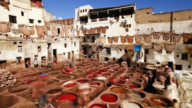 Chouwara traditional leather tannery in Old Fez, vats for tanning and dyeing leather hides and skins, Fez, Morocco, North Africa, T/Lapse