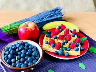 Fresh blueberries and waffles with rasberries 