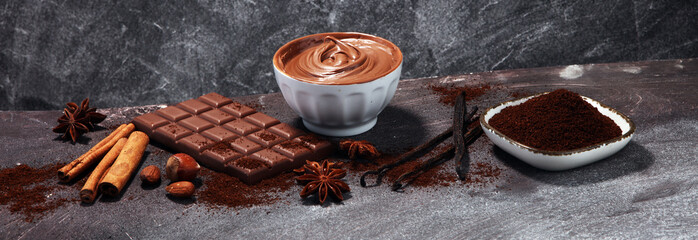 Chocolate bars on table with chocolate powder.