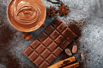 Chocolate bars on table with chocolate powder.