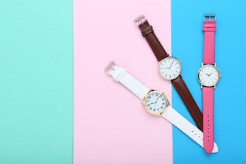Wrist watches on colorful background