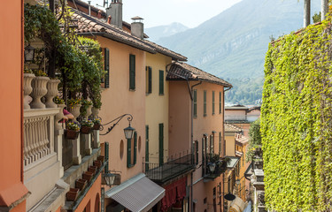 Fototapeta na wymiar narrow street down to the lake Italy