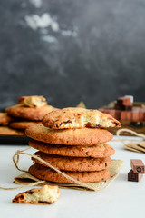 Chocolate cookies on wooden table. Chocolate chip cookies shot.