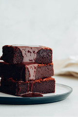 Chocolate brownie square pieces. American traditional delicious dessert. Close up photography.