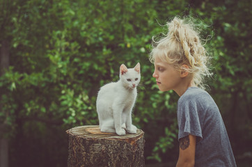 child and white cat