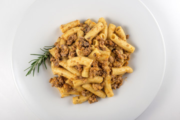 Plate of macaroni pasta with Bolognese ragù