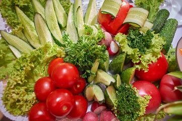 Vegetables sliced, tomatoes, cucumbers and greens