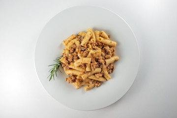 Plate of macaroni pasta with Bolognese ragù