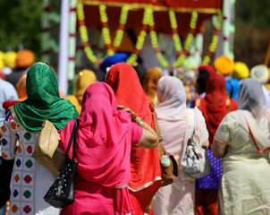 Fototapeta premium sikh women with colored dress in the street