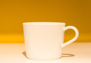 white cup for tea on a beautiful background, close-up