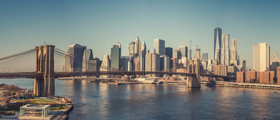 Brooklyn bridge and Manhattan at sunny day, New York City