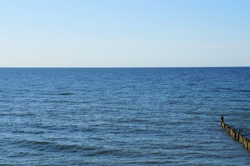 Fototapeta premium Wellenbrecher Srand und Meer