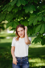 Beautiful girl in a green park.