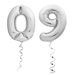 Silver number 09 made of inflatable party balloons with silver ribbons isolated on white background