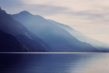 Fototapeta na wymiar Foggy mountains near lake Garda Italy