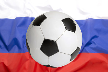 Naklejka premium Soccer ball on Russian flag
