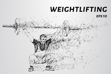 Fototapeta na wymiar Weightlifter of particles. Weightlifter raises the bar over his head.