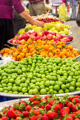 Fototapeta na wymiar Buyers in the vegetable and fruit market