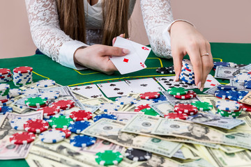 Woman showing combination of two aces and making bet