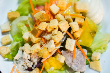 Close up Healthy Vegetable Salad and blue background.