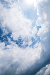 Sun rays break through the cloudy sky, beautiful background with place for text for designer work