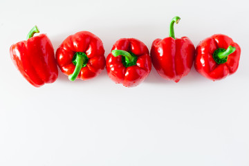 group of red ripe organic bell pepper  isolated on white. copy space