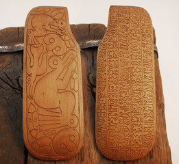 Ancient wood carving signs both sides