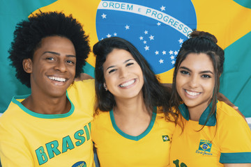 Group of happy brazilian soccer fans in vintage retro look