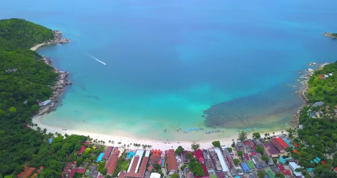Aerial: Haad Rin beach line, taxi boats area, view from the drone, Phangan island, Thailand