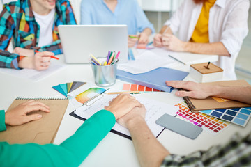 Close-up of business team working with color samples at the table