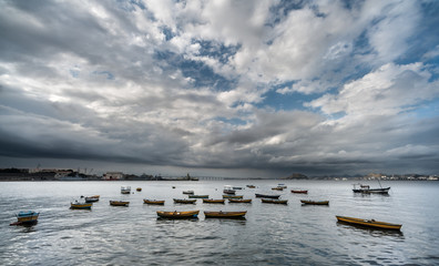 Fishing boats in dramatic landscape
