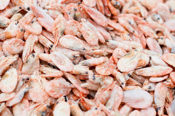 Frozen shrimp in market. Seafood in supermarket.Many shrimps in ice at restaurant kitchen. Healthy food for sushi. Selective focus.