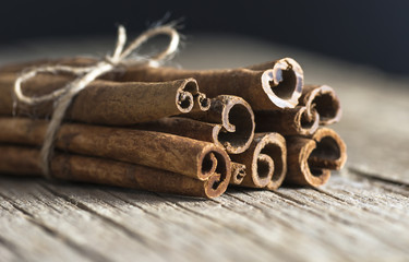 Close up cinnamon healthy spice on wooden background