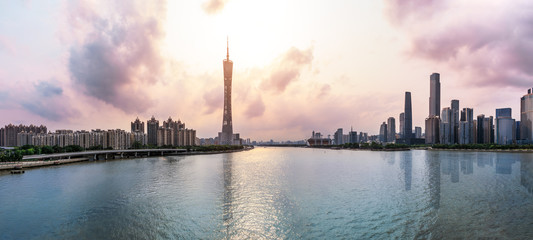Naklejka premium Guangzhou,China modern city skyline panorama on the zhujiang river at sunset
