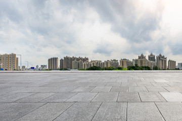 empty square floors and modern city skyline in Guangzhou at dusk,China