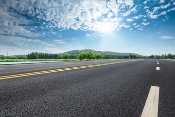 Empty asphalt road and mountains with sky clouds landscape