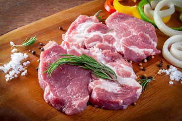 Fresh raw pork on wooden background.