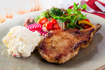 pork chop with vegetable in plate