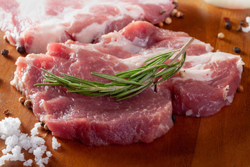 Fresh raw pork on wooden background.