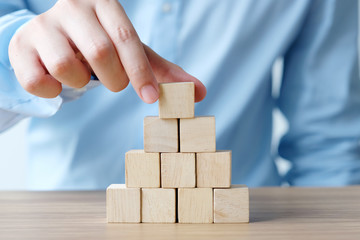 Hand holding wooden cubes, business concept background, mock up, template