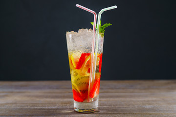 Refreshing cocktail with kiwi and strawberry, cold iced drink. Summer delightful beverage, party, bar concept