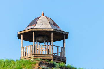 Old wooden rotunda on sea coast