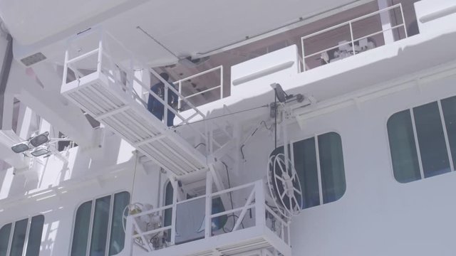 2 in 1 Worker on the slider scaffold doing maintenance on the cruise ship - St. Thomas August 2017