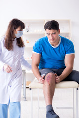 Patient visiting doctor after sustaining sports injury