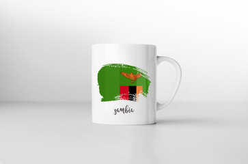 Zambia flag souvenir mug on white background. 3D rendering.