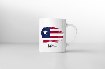 Liberia flag souvenir mug on white background. 3D rendering.