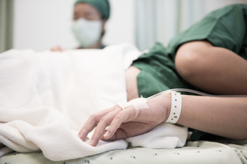 Woman patient admitted to the hospital with saline intravenous (iv)