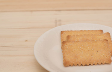 Cookies cracker on a white plate.