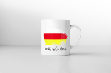 North Ossetia-Alania Islands flag souvenir mug on white backgrou